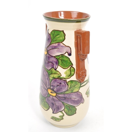 125 - Watcombe Torquay Pottery - A 20th Century circa 1930s ceramic Art Deco faience earthenware vase. The... 