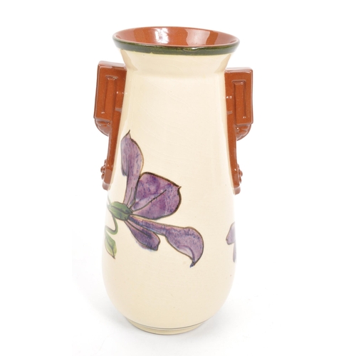 125 - Watcombe Torquay Pottery - A 20th Century circa 1930s ceramic Art Deco faience earthenware vase. The... 