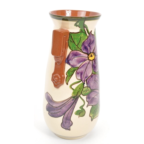 125 - Watcombe Torquay Pottery - A 20th Century circa 1930s ceramic Art Deco faience earthenware vase. The... 