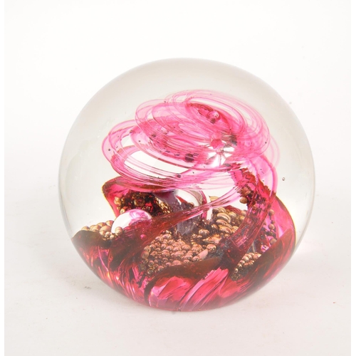 135 - Mdina / Selkirk - A collection of four mid 20th century studio art glass paperweights. The collectio... 