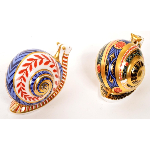 15 - Royal Crown Derby - Two porcelain china Royal Crown Derby imari paperweight figures in the form of s... 