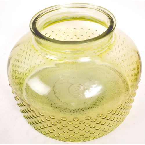 155 - A large 20th Century retro round squat green glass vase / carboy with textured circular design to bo... 