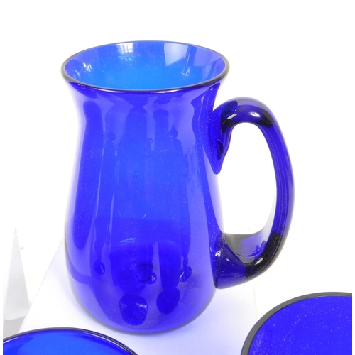 162 - Bristol Blue Glass - A collection of Bristol Blue Glass comprising of a decanter, six wine / stem gl... 