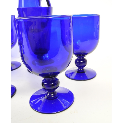 162 - Bristol Blue Glass - A collection of Bristol Blue Glass comprising of a decanter, six wine / stem gl... 