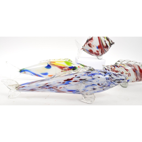 172 - Murano - A collection of four Italian studio art glass fish ornaments. Graduating sizes, with millef... 