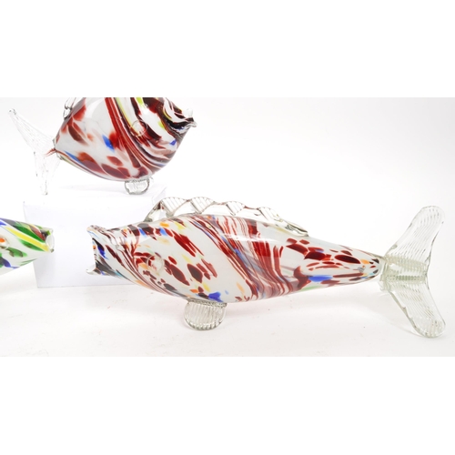 172 - Murano - A collection of four Italian studio art glass fish ornaments. Graduating sizes, with millef... 