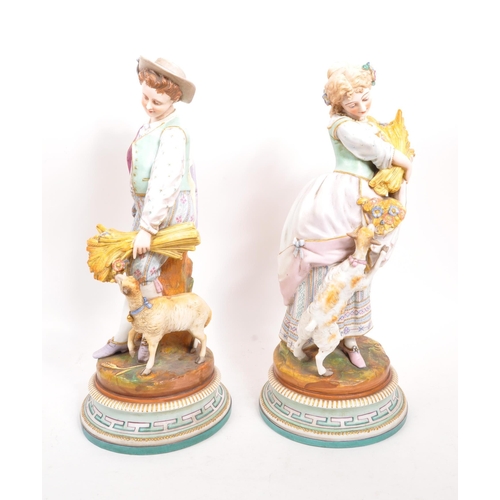 180 - A pair of 19th century Italian porcelain figures. The figures each raised on round pedestal bases, w... 