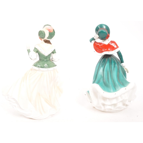 183 - Royal Doulton - Two contemporary porcelain china Christmas Day lady figurines. Christmas Day 2001 an... 