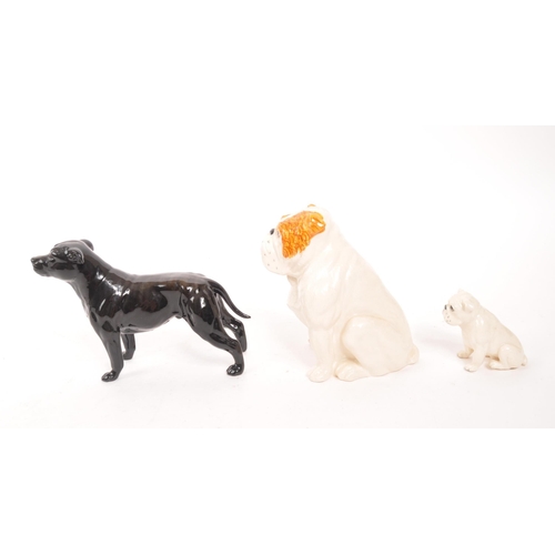 186 - Royal Doulton / Beswick - A collection of three china dog figures, comprising of an English Bulldog ... 