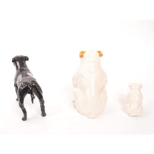 186 - Royal Doulton / Beswick - A collection of three china dog figures, comprising of an English Bulldog ... 