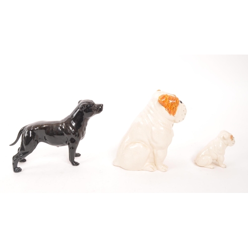 186 - Royal Doulton / Beswick - A collection of three china dog figures, comprising of an English Bulldog ... 