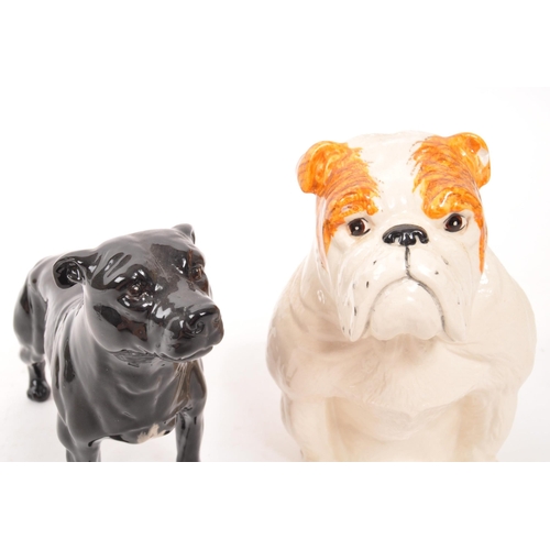 186 - Royal Doulton / Beswick - A collection of three china dog figures, comprising of an English Bulldog ... 