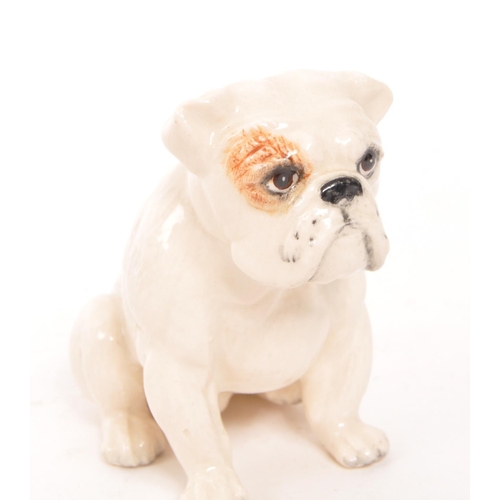 186 - Royal Doulton / Beswick - A collection of three china dog figures, comprising of an English Bulldog ... 