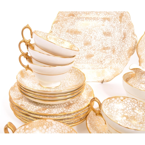 192 - Hammersley - A 20th century Hammersley 415 gold and white china tea service. The tea service having ... 