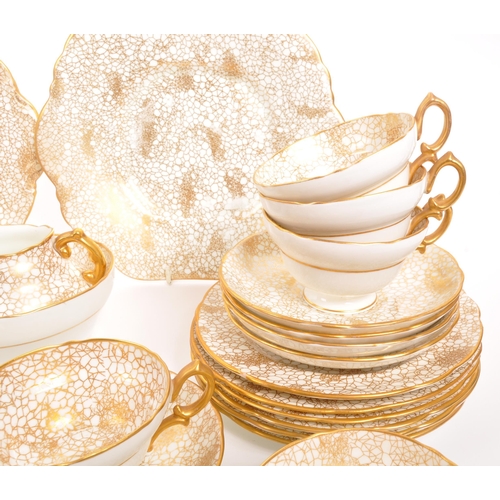 192 - Hammersley - A 20th century Hammersley 415 gold and white china tea service. The tea service having ... 