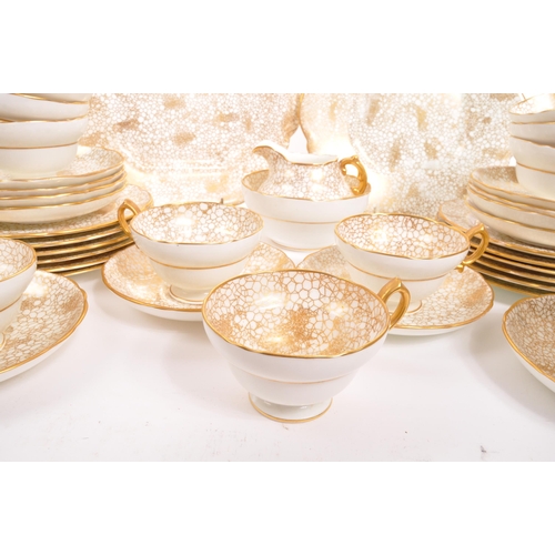 192 - Hammersley - A 20th century Hammersley 415 gold and white china tea service. The tea service having ... 