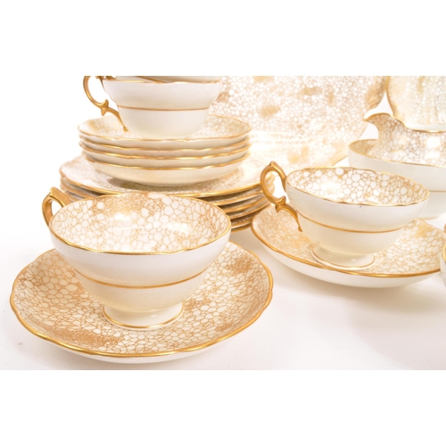 192 - Hammersley - A 20th century Hammersley 415 gold and white china tea service. The tea service having ... 