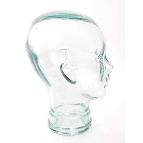 198 - A vintage 20th century pressed green clear glass milliners / phrenology type head bust having moulde... 