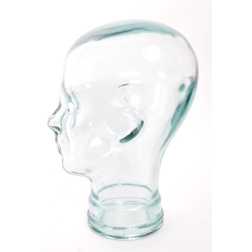 198 - A vintage 20th century pressed green clear glass milliners / phrenology type head bust having moulde... 