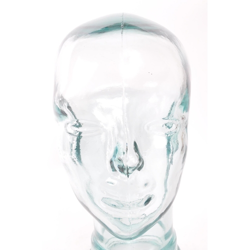 198 - A vintage 20th century pressed green clear glass milliners / phrenology type head bust having moulde... 