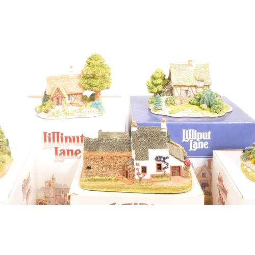 206 - Lilliput Lane - A collection of five 20th Century vintage Lilliput Lane cottage model figures all in... 