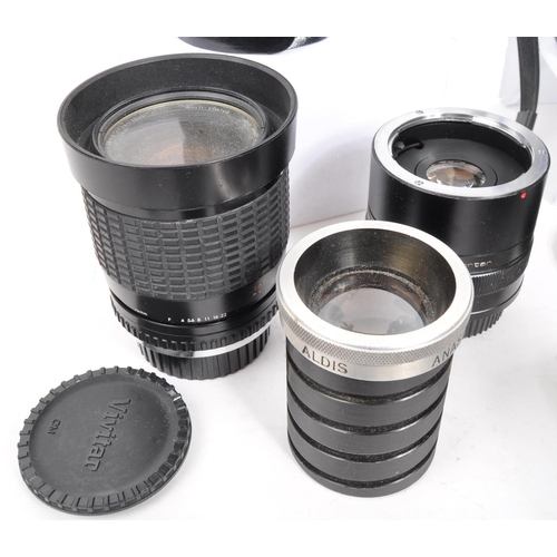 209 - A collection of 20th century manual focus 35mm O/OM mount camera lenses. The collection to include a... 