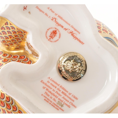 21 - Royal Crown Derby - A pair of porcelain china limited edition Royal Crown Derby millenium dragon pap... 