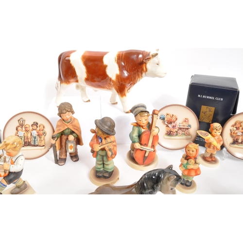 210 - W. Goebel - A collection of mid Century German W. Goebel for Hummel porcelain china figurines compri... 