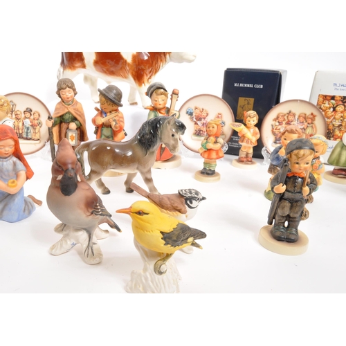 210 - W. Goebel - A collection of mid Century German W. Goebel for Hummel porcelain china figurines compri... 