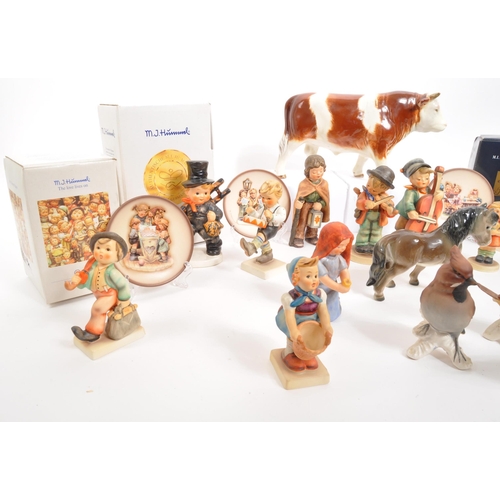 210 - W. Goebel - A collection of mid Century German W. Goebel for Hummel porcelain china figurines compri... 