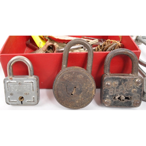 214 - A large collection of 20th century keys and locks. The collection including examples from Squire, Er... 