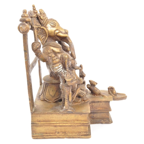 215 - A large brass Indian Hindu figure statue of the Lord Ganesha sat upon square raised base with the go... 