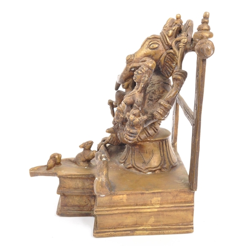 215 - A large brass Indian Hindu figure statue of the Lord Ganesha sat upon square raised base with the go... 