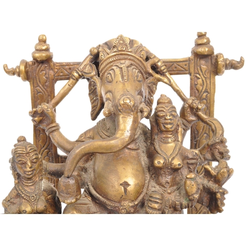 215 - A large brass Indian Hindu figure statue of the Lord Ganesha sat upon square raised base with the go... 