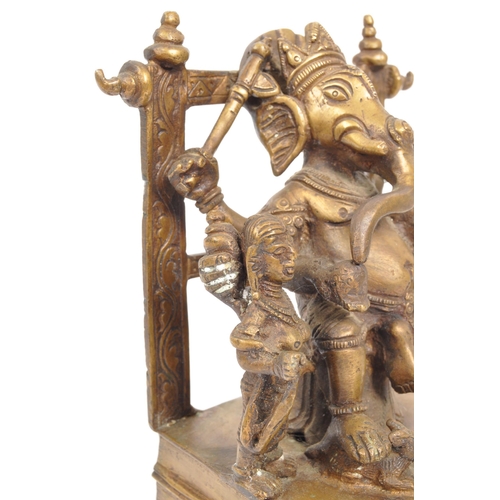 215 - A large brass Indian Hindu figure statue of the Lord Ganesha sat upon square raised base with the go... 