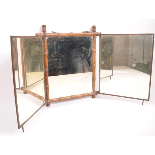 218 - An early 20th Century opening three piece triptych mirror having bamboo frame with Art Nouveau print... 