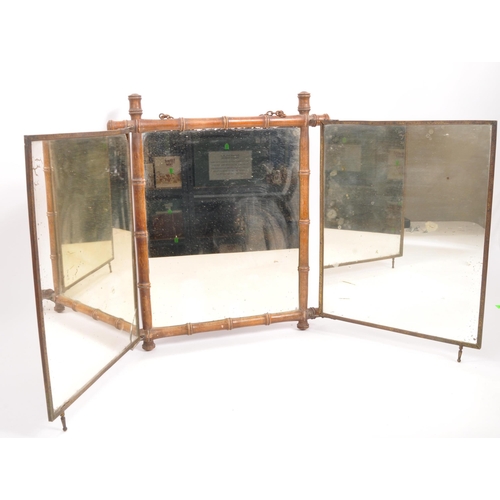 218 - An early 20th Century opening three piece triptych mirror having bamboo frame with Art Nouveau print... 