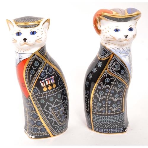 22 - Royal Crown Derby - Two porcelain china Royal Crown Derby paperweight figures from the Royal Cats co... 