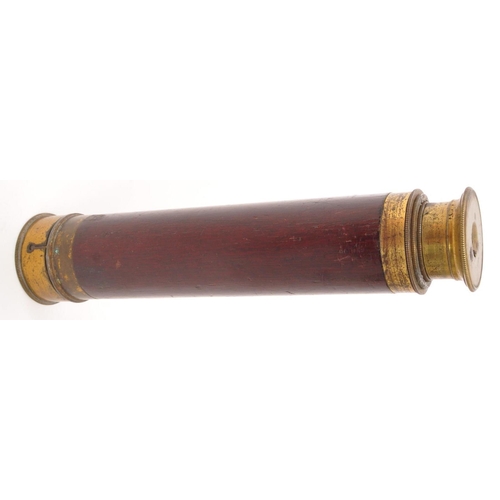 223 - A 20th Century small brass and wood four draw monocular telescope / spyglass. With lid. Measuring ap... 