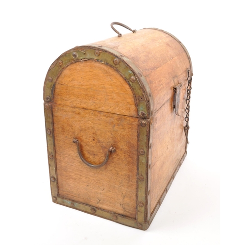 227 - A 19th century oak wood domed top bottle casket box. The casket having a hinged lid to top, with met... 