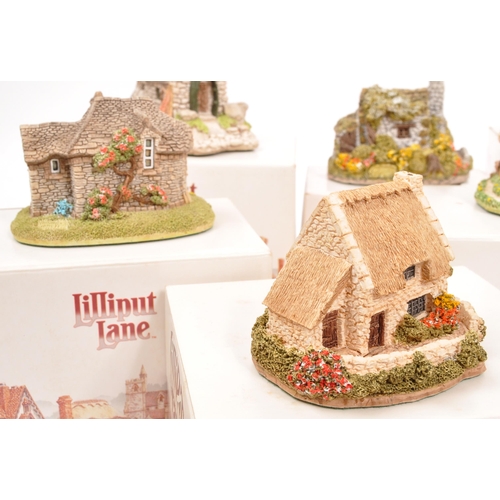 235 - Lilliput Lane - A collection of eleven small Lilliput Lane cottage model figures all in original box... 