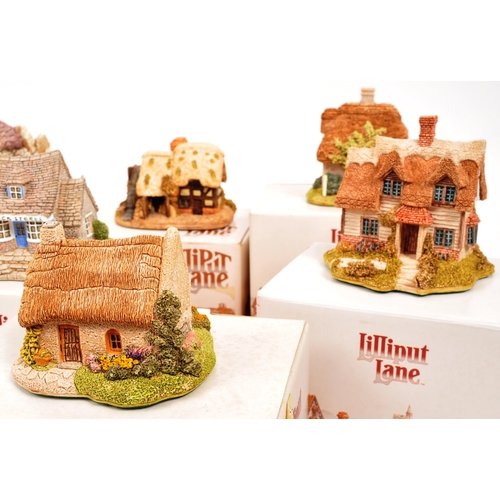 235 - Lilliput Lane - A collection of eleven small Lilliput Lane cottage model figures all in original box... 