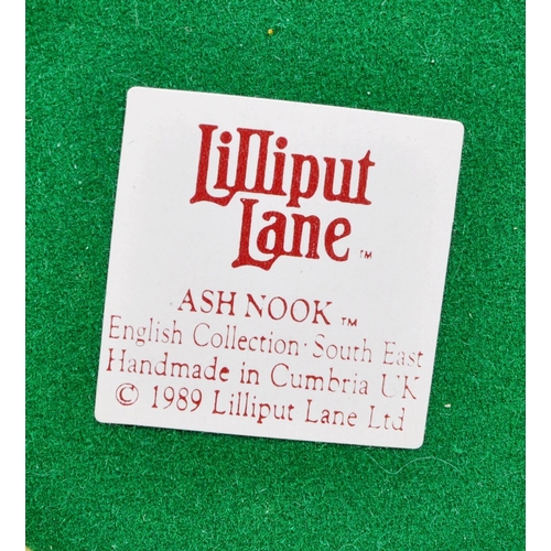 235 - Lilliput Lane - A collection of eleven small Lilliput Lane cottage model figures all in original box... 