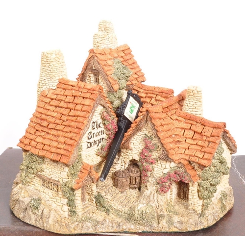 239 - David Winter - A collection of David Winter cottages model figures comprising of eight in original b... 