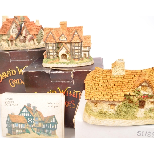 239 - David Winter - A collection of David Winter cottages model figures comprising of eight in original b... 