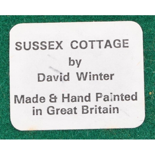 239 - David Winter - A collection of David Winter cottages model figures comprising of eight in original b... 