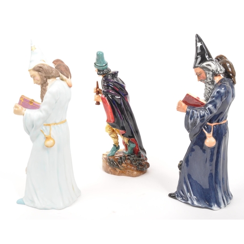 24 - Royal Doulton - A collection of three porcelain china Royal Doulton figurines. Comprising of The Wiz... 