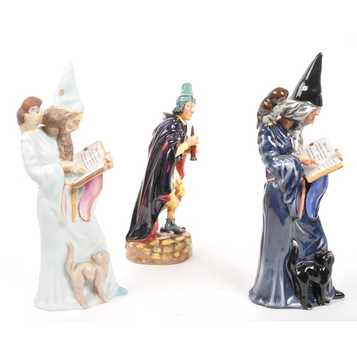 24 - Royal Doulton - A collection of three porcelain china Royal Doulton figurines. Comprising of The Wiz... 