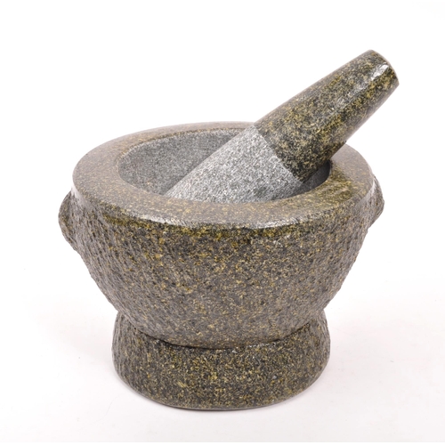 240 - A large volcanic rock style molcajete / pestle and mortar. Raised on a rounded base, with large bowl... 