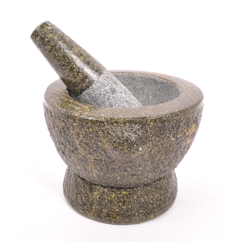 240 - A large volcanic rock style molcajete / pestle and mortar. Raised on a rounded base, with large bowl... 